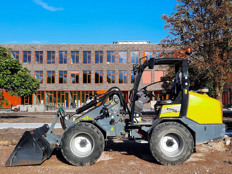 Compact wheel loader moving material